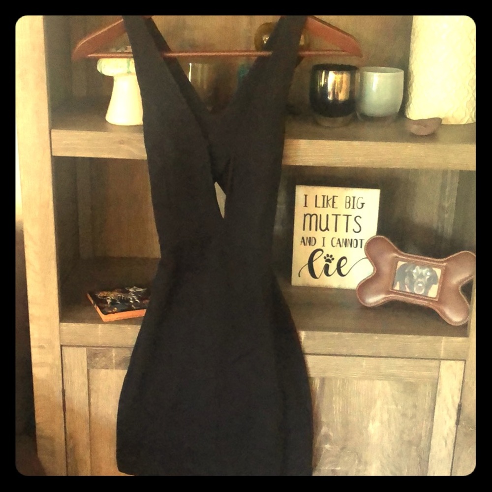 Stretchy black club dress with plunging neckline